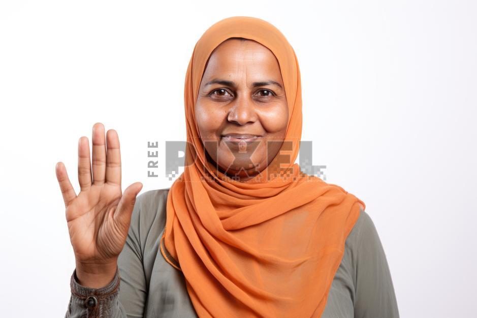 Free Photos - A Woman Wearing A Headscarf Is Raising Her Hand, Showing ...