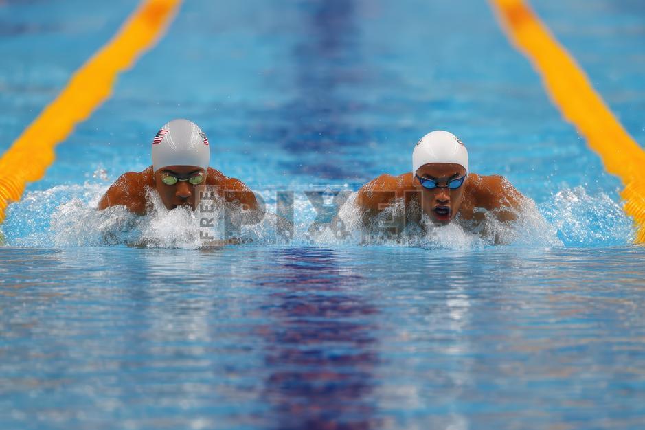 Free Photos - Male Swimmers Swimming In Motion At Pool For Competitive ...